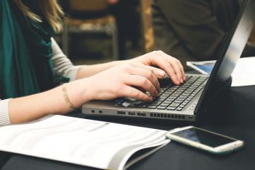 Laptop and hands of someone typing